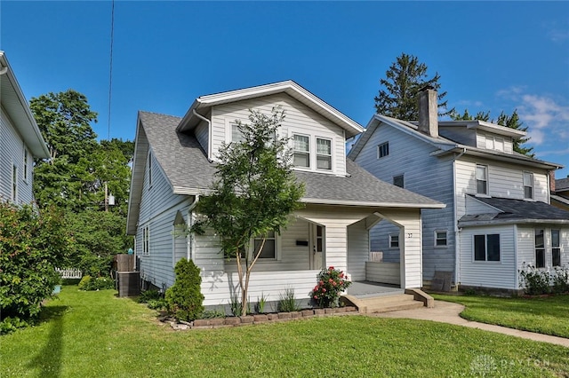 27 S Quentin Ave, Dayton, OH 45403 - bungalow-style home with a porch, roof with shingles, and a front lawn