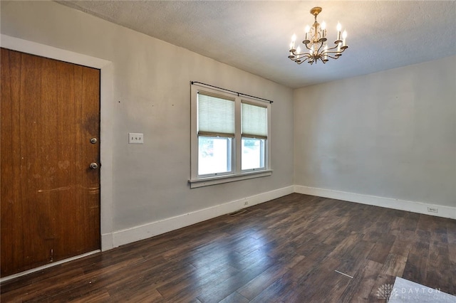 27 S Quentin Ave, Dayton, OH 45403 - unfurnished room with a chandelier, wood finished floors, and a textured ceiling
