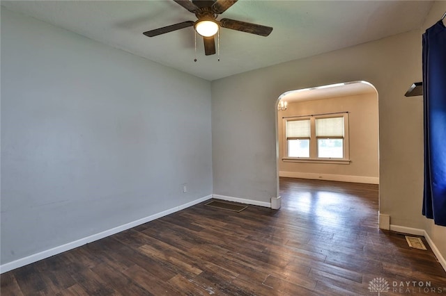27 S Quentin Ave, Dayton, OH 45403 - empty room featuring a ceiling fan, dark wood finished floors, and arched walkways