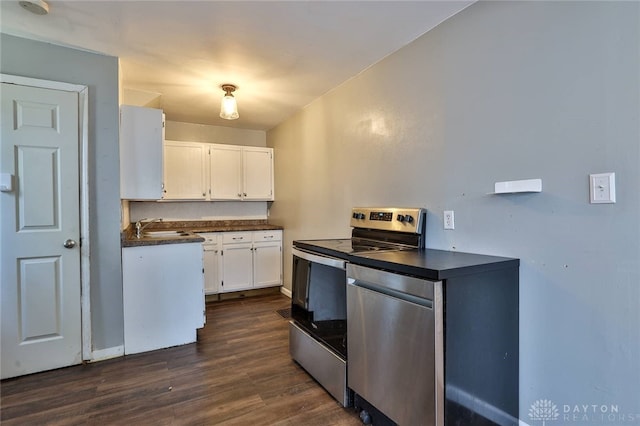 27 S Quentin Ave, Dayton, OH 45403 - kitchen featuring appliances with stainless steel finishes, dark countertops, white cabinets, and dark wood-style floors