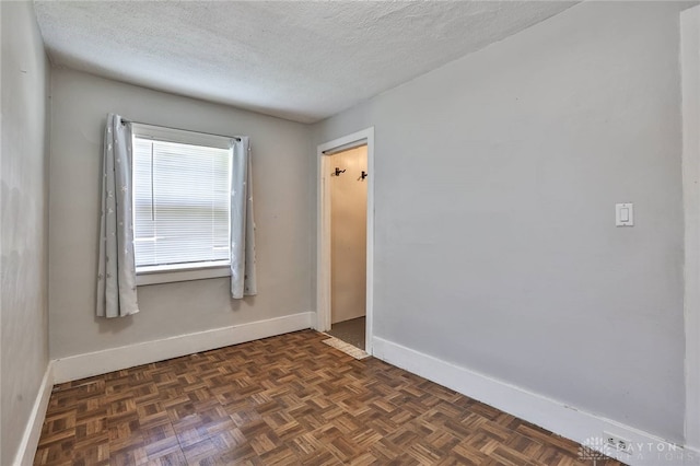 27 S Quentin Ave, Dayton, OH 45403 - spare room with baseboards and a textured ceiling