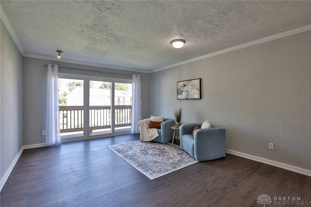 5695 E Coach Dr Unit E, Kettering, OH 45440 - sitting room with a textured ceiling, wood finished floors, crown molding, and baseboards