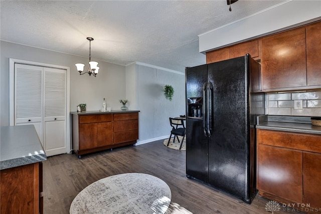 5695 E Coach Dr Unit E, Kettering, OH 45440 - kitchen featuring black refrigerator with ice dispenser, brown cabinetry, crown molding, dark wood-style flooring, and a chandelier