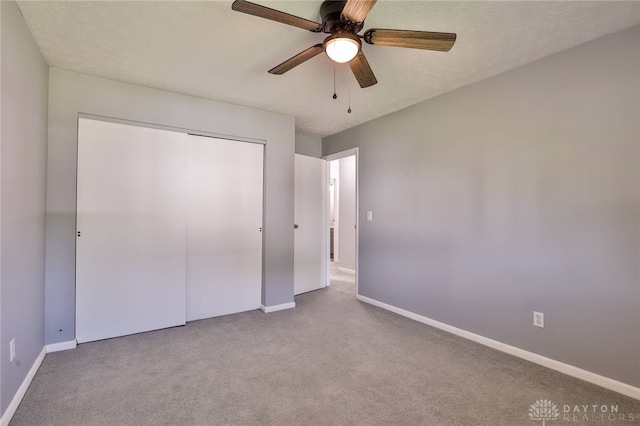 5695 E Coach Dr Unit E, Kettering, OH 45440 - unfurnished bedroom featuring baseboards, carpet floors, a closet, and ceiling fan