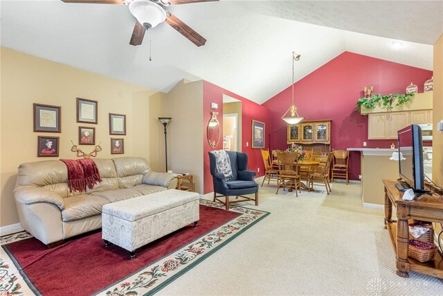 91 Villa Pointe Dr, Springboro, OH 45066 - carpeted living room with lofted ceiling, ceiling fan, and baseboards