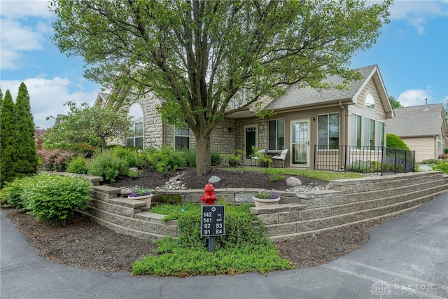 91 Villa Pointe Dr, Springboro, OH 45066 - ranch-style home with stone siding and a shingled roof