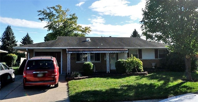 4812 Franlou Ave, Dayton, OH 45432 - ranch-style home with a garage, concrete driveway, a front lawn, and brick siding