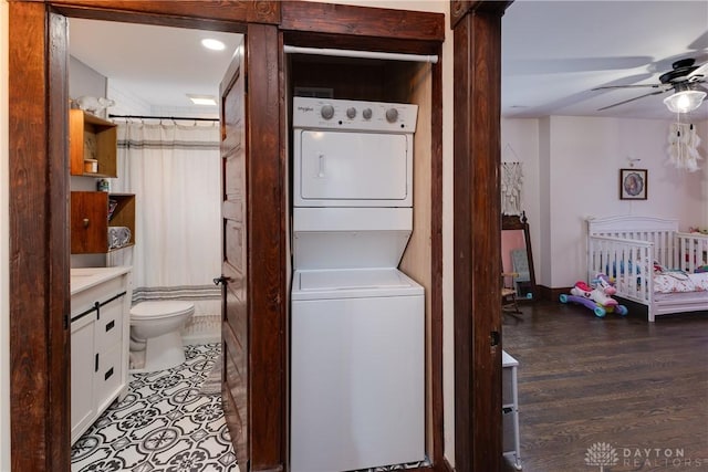 25 La Belle St, Dayton, OH 45403 - washroom with stacked washer and clothes dryer, ceiling fan, and light wood finished floors