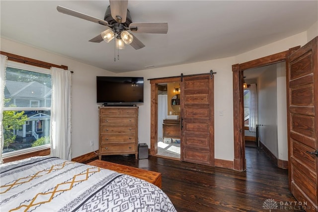25 La Belle St, Dayton, OH 45403 - bedroom with wood finished floors, a barn door, baseboards, and ceiling fan