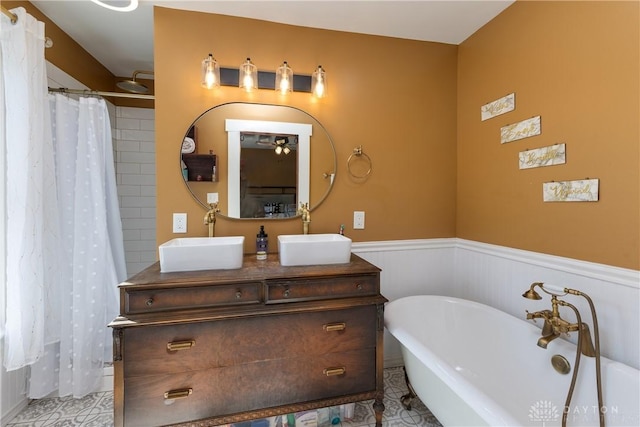 25 La Belle St, Dayton, OH 45403 - bathroom featuring tile patterned flooring, a freestanding tub, wainscoting, double vanity, and a shower with shower curtain