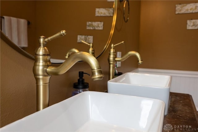 25 La Belle St, Dayton, OH 45403 - bathroom view of wainscoting, a soaking tub, and a sink