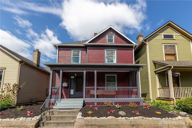 25 La Belle St, Dayton, OH 45403 - view of front facade with a porch and brick siding