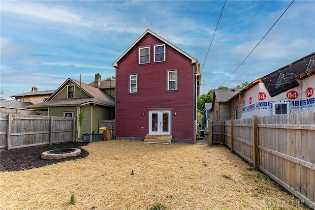 25 La Belle St, Dayton, OH 45403 - rear view of house featuring french doors, entry steps, and a fenced backyard