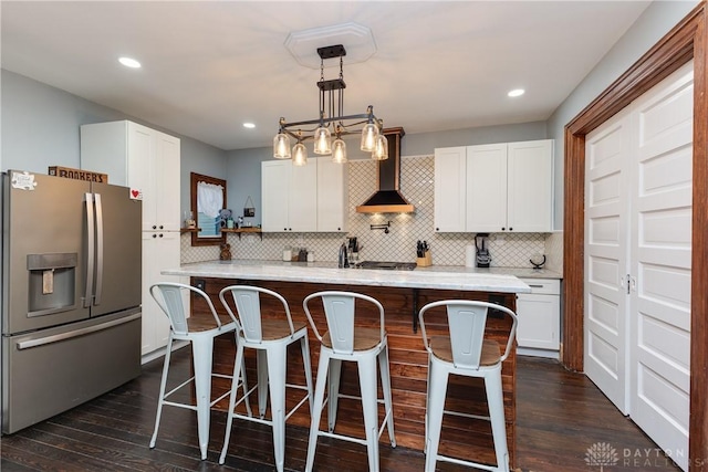 25 La Belle St, Dayton, OH 45403 - kitchen with stainless steel refrigerator with ice dispenser, wall chimney exhaust hood, dark wood-style flooring, white cabinets, and recessed lighting