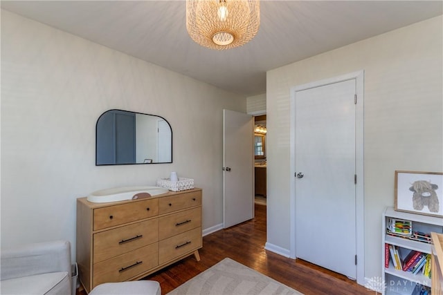 763 Lymington Rd, Troy, OH 45373 - bedroom featuring dark wood-type flooring and a chandelier