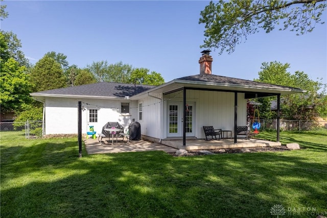 763 Lymington Rd, Troy, OH 45373 - rear view of property featuring a chimney and a patio area