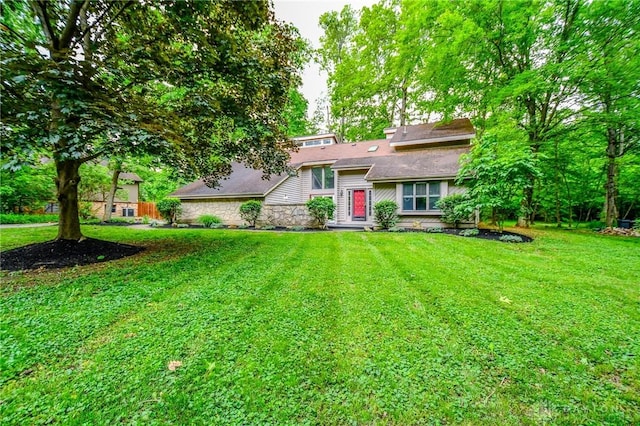222 Walnut Grove Dr, Centerville, OH 45458 - view of front of home with stone siding and a front lawn
