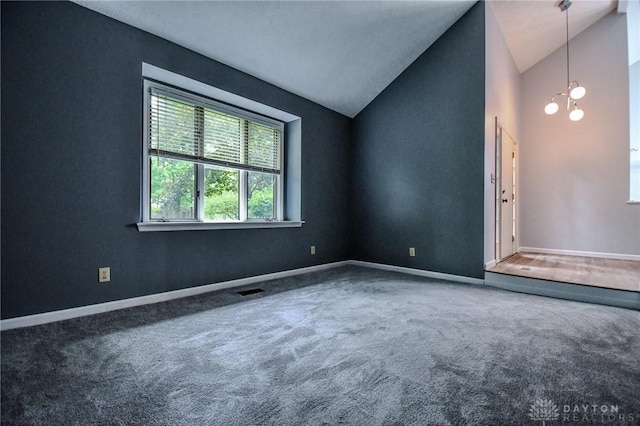 222 Walnut Grove Dr, Centerville, OH 45458 - spare room featuring vaulted ceiling, carpet flooring, a chandelier, and baseboards