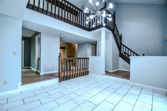 222 Walnut Grove Dr, Centerville, OH 45458 - foyer entrance featuring a high ceiling, a chandelier, baseboards, and stairway