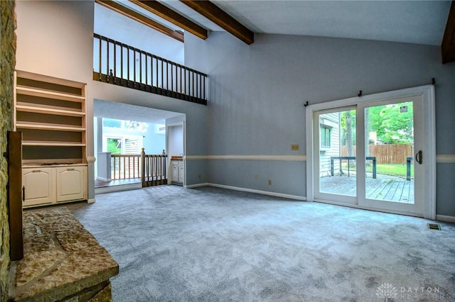 222 Walnut Grove Dr, Centerville, OH 45458 - unfurnished living room featuring carpet floors, beamed ceiling, baseboards, and high vaulted ceiling