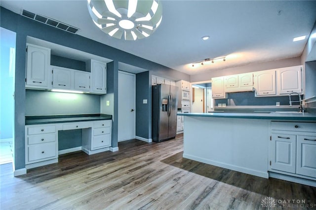 222 Walnut Grove Dr, Centerville, OH 45458 - kitchen with stainless steel refrigerator with ice dispenser, a sink, white cabinets, a peninsula, and dark wood finished floors