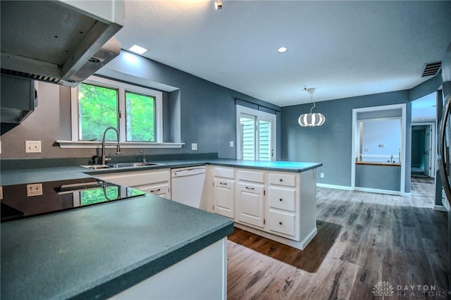 222 Walnut Grove Dr, Centerville, OH 45458 - kitchen featuring dishwasher, a sink, white cabinets, a peninsula, and wood finished floors