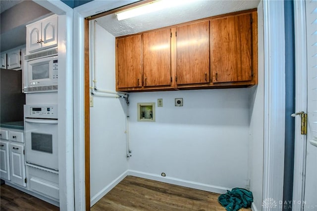222 Walnut Grove Dr, Centerville, OH 45458 - washroom with cabinet space, washer hookup, dark wood finished floors, baseboards, and gas dryer hookup