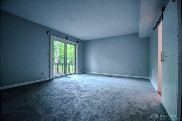 222 Walnut Grove Dr, Centerville, OH 45458 - carpeted spare room featuring a barn door and baseboards