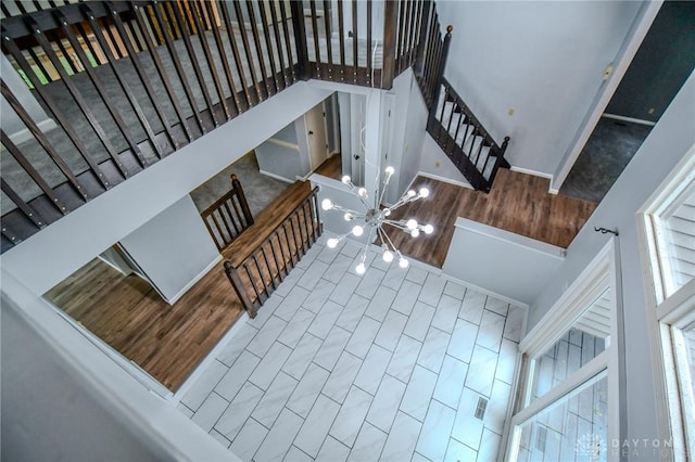 222 Walnut Grove Dr, Centerville, OH 45458 - stairs with a high ceiling, healthy amount of natural light, and a chandelier