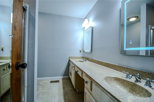 222 Walnut Grove Dr, Centerville, OH 45458 - bathroom featuring double vanity, tile patterned floors, and baseboards