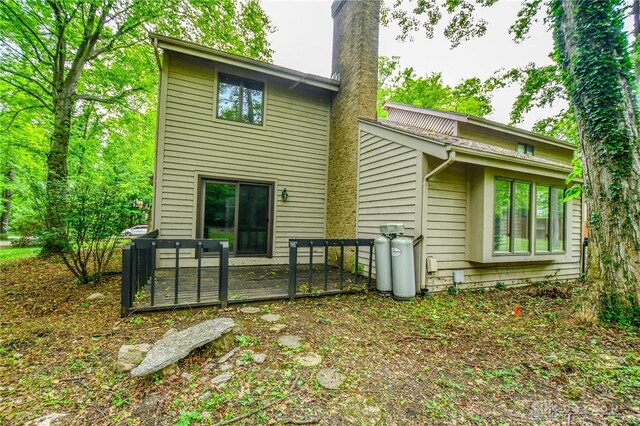 222 Walnut Grove Dr, Centerville, OH 45458 - back of house with a chimney and a deck