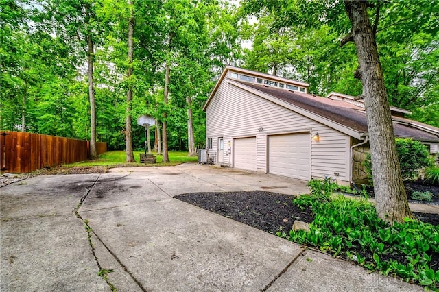 222 Walnut Grove Dr, Centerville, OH 45458 - garage featuring central AC and driveway