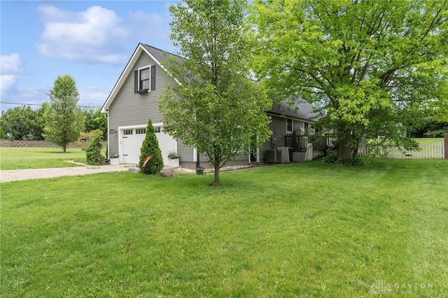 2242 Turnbull Rd, Beavercreek, OH 45431 - view of side of property with a garage, driveway, and central AC unit