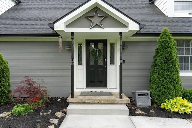 2242 Turnbull Rd, Beavercreek, OH 45431 - entrance to property with a shingled roof and a garage