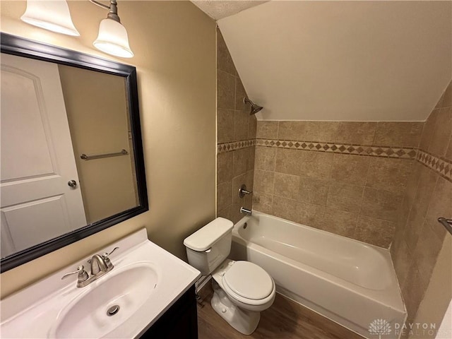5901 Timbergate Trl, Dayton, OH 45424 - full bathroom with vanity, toilet, wood finished floors, tub / shower combination, and vaulted ceiling