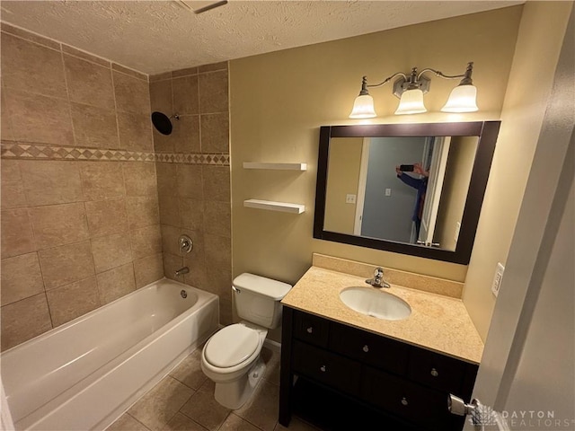 5901 Timbergate Trl, Dayton, OH 45424 - bathroom featuring toilet, a textured ceiling, vanity, washtub / shower combination, and tile patterned floors