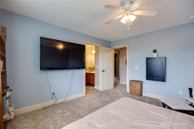 10067 Yearling Run, Dayton, OH 45458 - bedroom with light carpet, baseboards, connected bathroom, and a ceiling fan