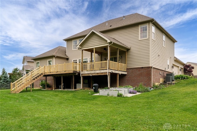 10067 Yearling Run, Dayton, OH 45458 - rear view of property featuring a wooden deck, central AC unit, a ceiling fan, a lawn, and stairs