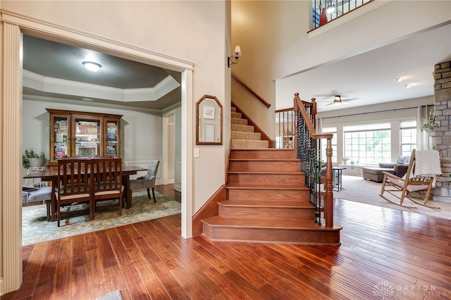 10067 Yearling Run, Dayton, OH 45458 - stairway featuring ornamental molding, hardwood / wood-style flooring, a ceiling fan, and wainscoting
