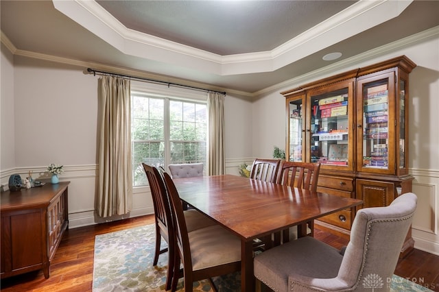 10067 Yearling Run, Dayton, OH 45458 - dining space featuring a tray ceiling, wood finished floors, wainscoting, crown molding, and a decorative wall