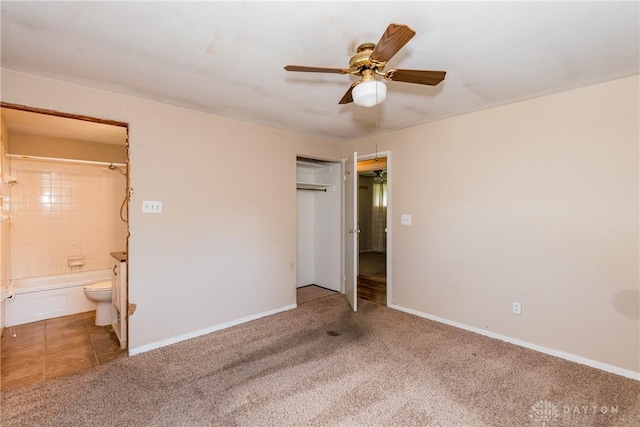 5501 Harshmanville Rd, Dayton, OH 45424 - unfurnished bedroom with light carpet, ensuite bath, baseboards, and a closet