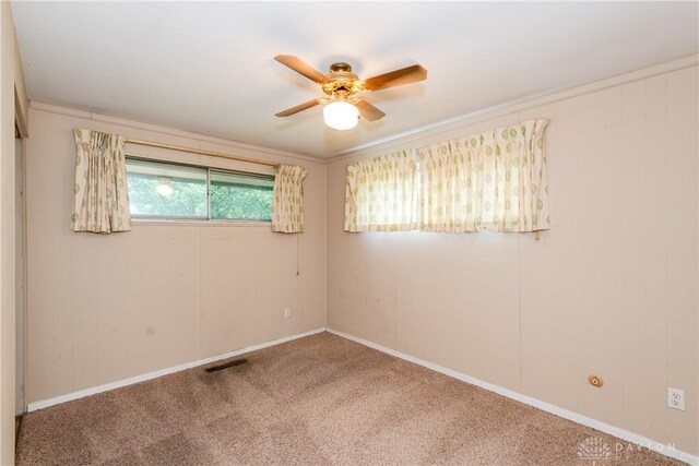 5501 Harshmanville Rd, Dayton, OH 45424 - unfurnished room with a ceiling fan, carpet floors, and baseboards