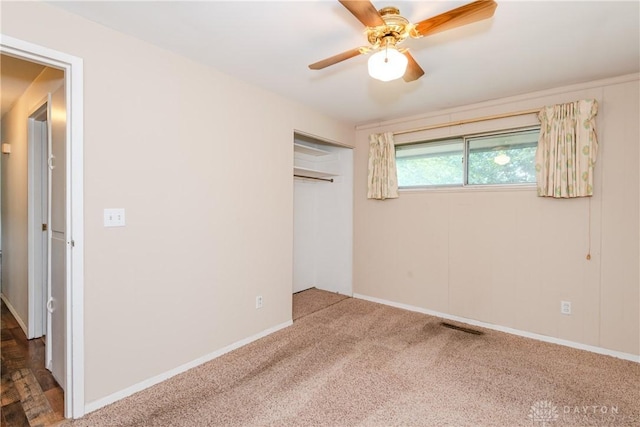5501 Harshmanville Rd, Dayton, OH 45424 - unfurnished bedroom featuring carpet floors, a closet, baseboards, and ceiling fan
