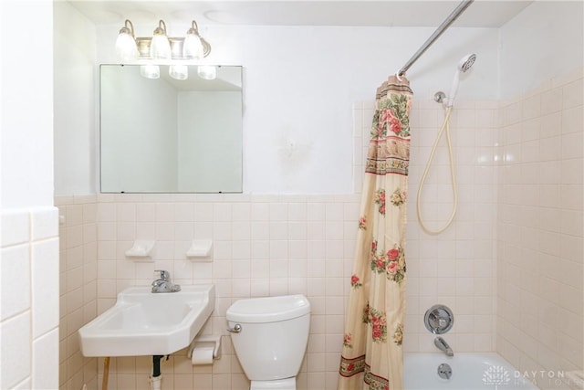 5501 Harshmanville Rd, Dayton, OH 45424 - bathroom with a sink, toilet, shower / bathtub combination with curtain, tile walls, and wainscoting
