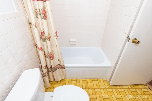 5501 Harshmanville Rd, Dayton, OH 45424 - bathroom with toilet, tile patterned floors, shower / bathtub combination with curtain, and tile walls