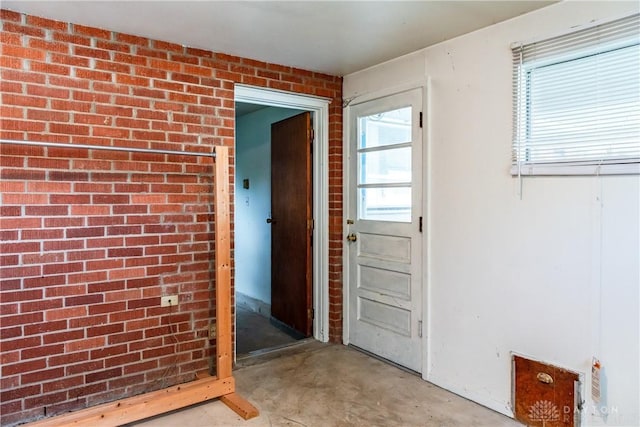 5501 Harshmanville Rd, Dayton, OH 45424 - doorway with concrete flooring and brick wall