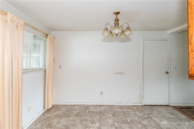 5501 Harshmanville Rd, Dayton, OH 45424 - unfurnished room featuring a chandelier