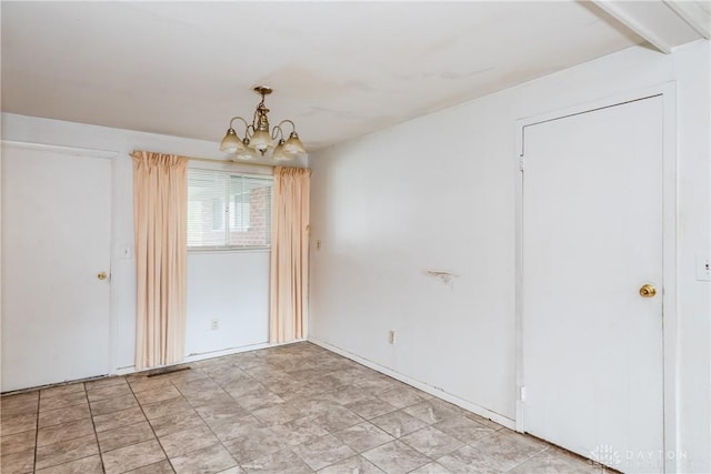 5501 Harshmanville Rd, Dayton, OH 45424 - spare room featuring a chandelier