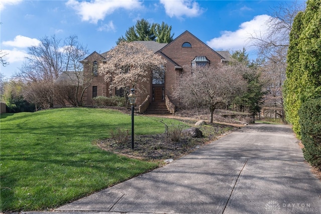 514 Shambord Cir, Kettering, OH 45429 - tudor home featuring a front yard and brick siding