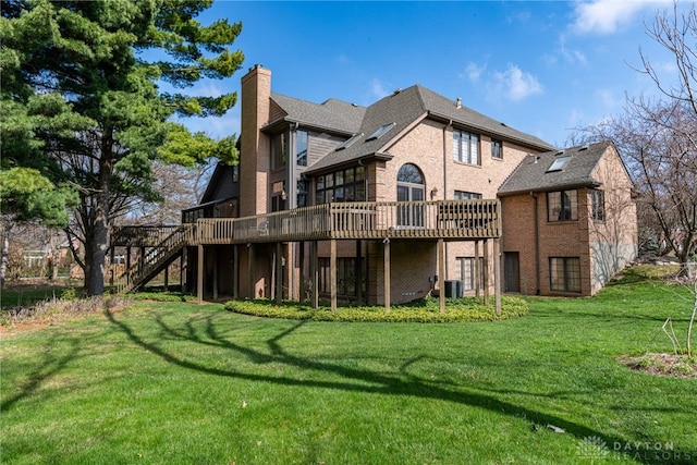 514 Shambord Cir, Kettering, OH 45429 - rear view of house featuring a chimney, a deck, stairway, and brick siding